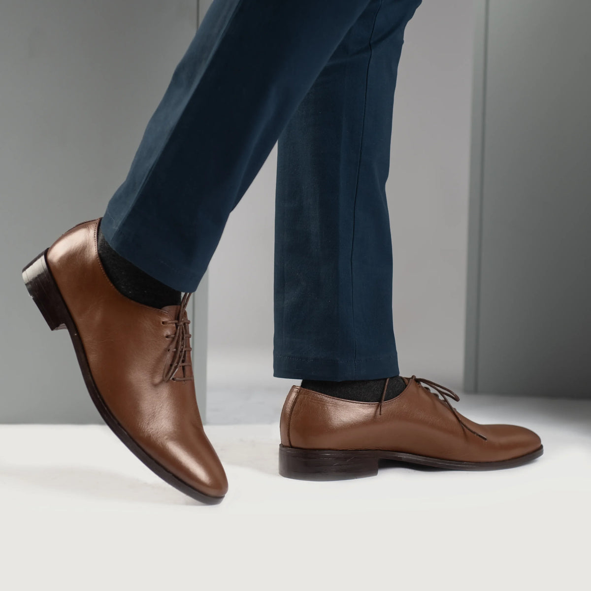 Styled Fit Perspective of Director Wholecut Tan Leather Shoes on Model - Natural Daylight Drape
