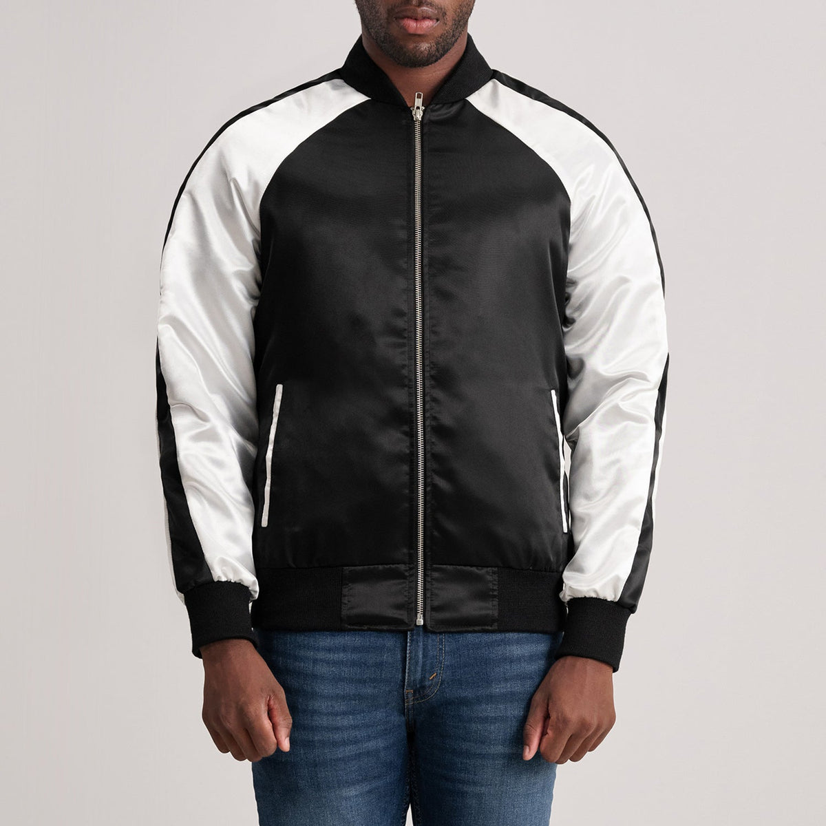 
Clarke Black Varsity Jacket in Black & White Satin - Front Profile View & Tailored Silhouette | Buy Online