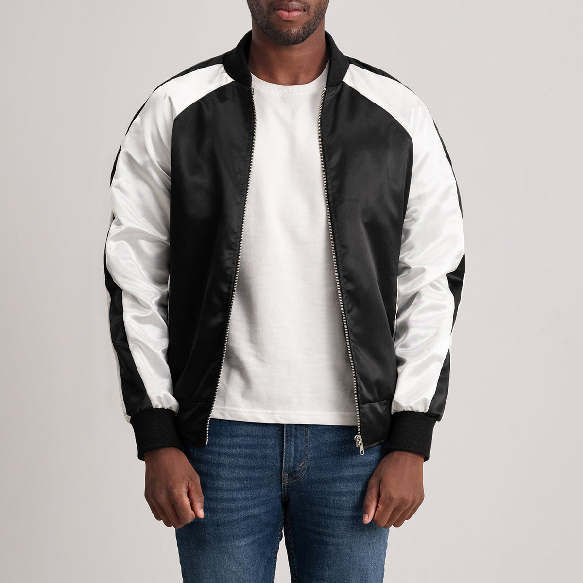 
Clarke Black Varsity Jacket - Lateral Side Profile View Showing Sleeve Cut & Athletic Taper Fit